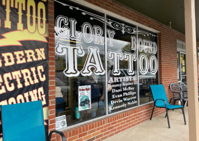 Exterior window sign at Glory Bound Tattoo.