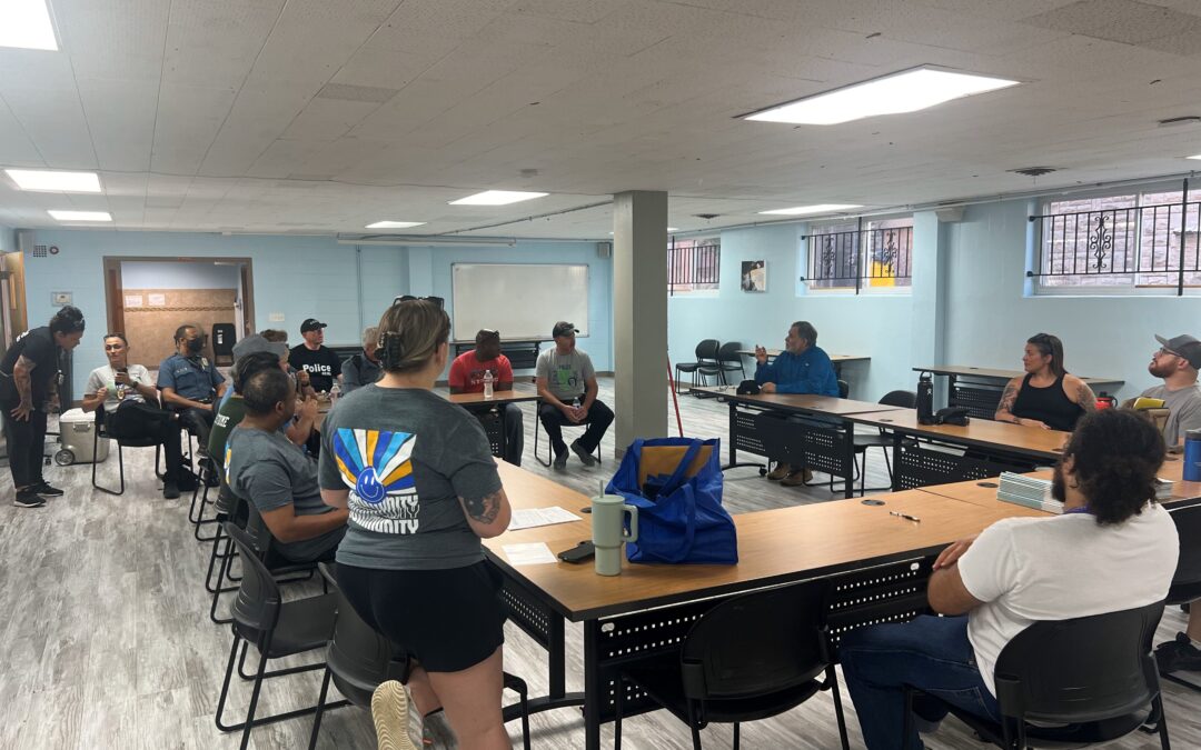 Group of people sit around tables and talking