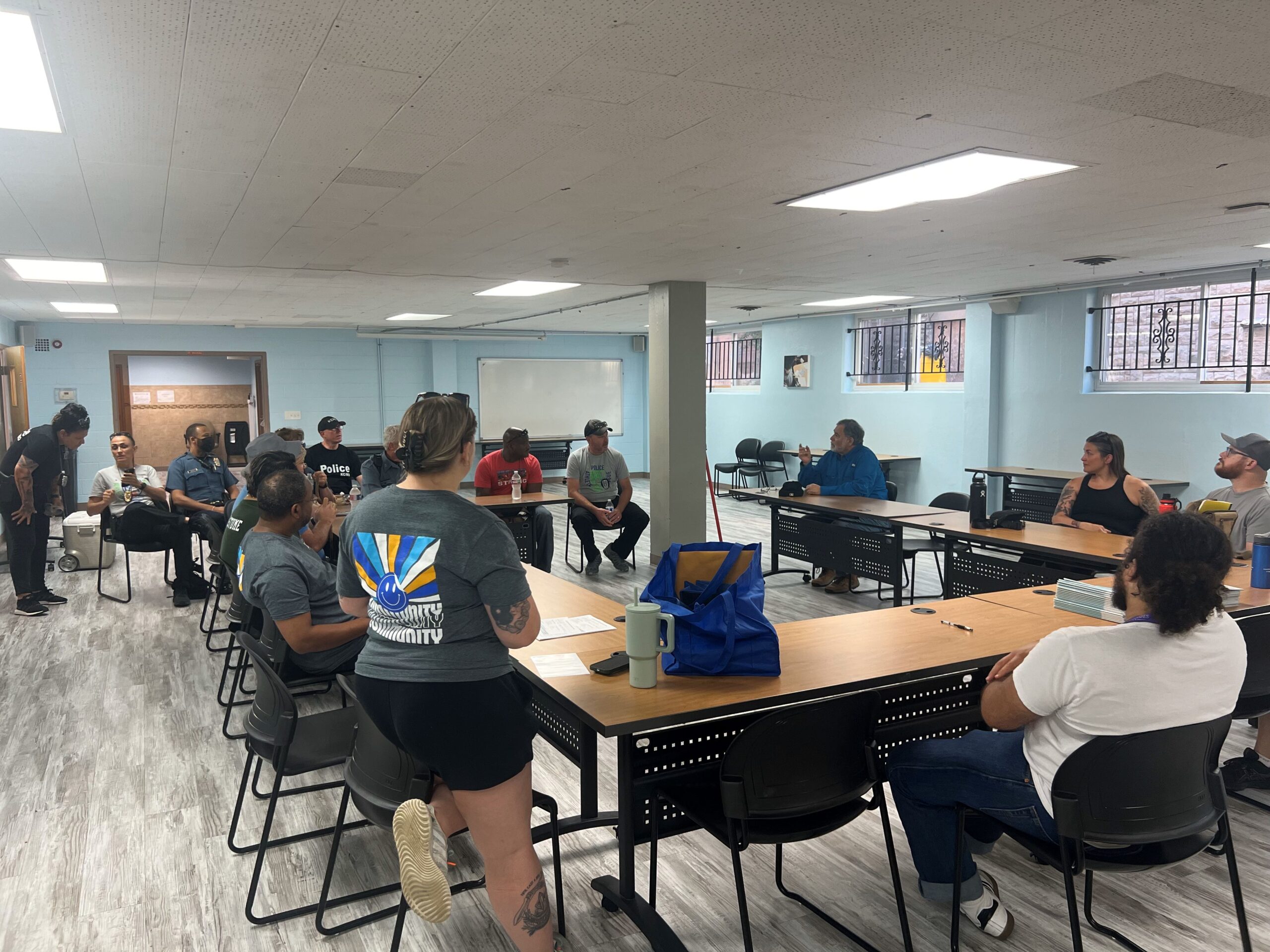 Group of people sit around tables and talking