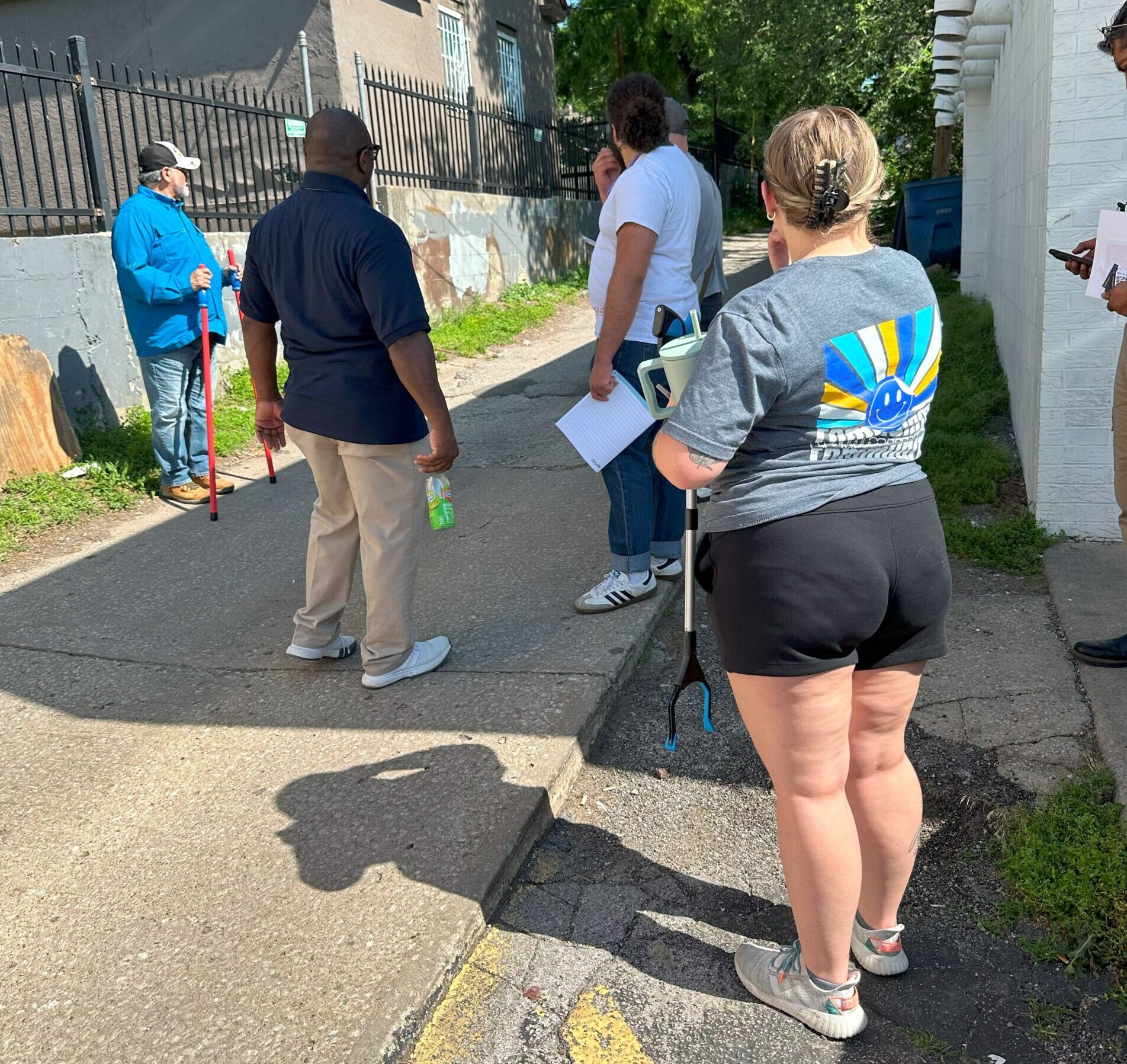 CPTED Walkthrough Group of people stand in an alley of North Indian Mound neighborhood