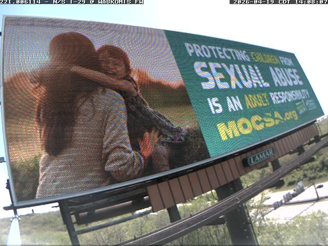 SWAO Billboard 2026 Photo of billboard of a child hugging an adult female with white text on a teal background that reads protecting children from sexual abuse is an adult responsibility mocsa.org.